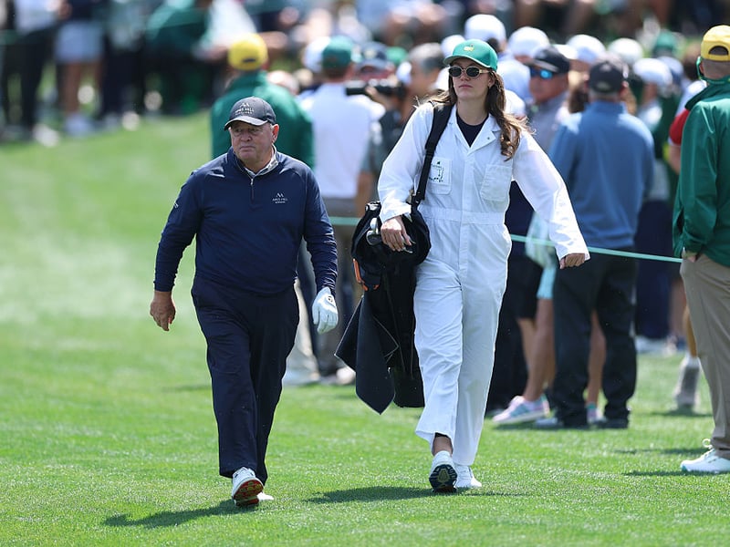 Ian Woosnam of Wales walks with his caddie during the Par Three Contest.