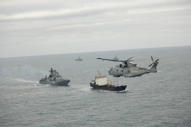A Merlin from 814 Naval Air Squadron takes part in monitoring operations with HMS Somerset and St Albans