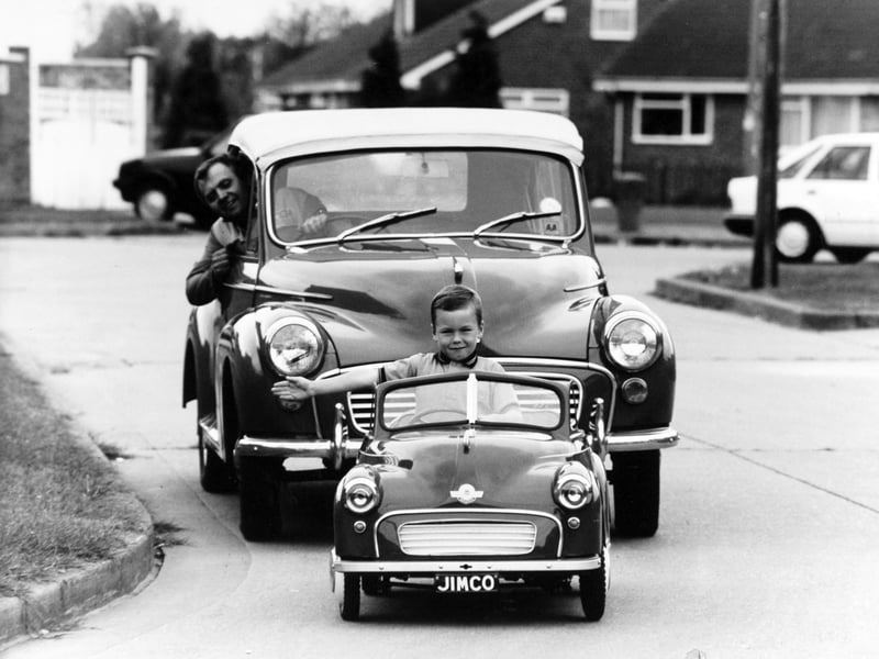 A six-year-old Lee Waud tries a miniature Morris Minor. as its creator, James Lambert, of Hull, follows in a normal-sized model in May 1991. Mr Lambert, a motor enthusiast from Jendale, became so carried away while tinkering with scrapped Morris Minors to find parts for his own model that he decided to build his own perfect half-sized replica.