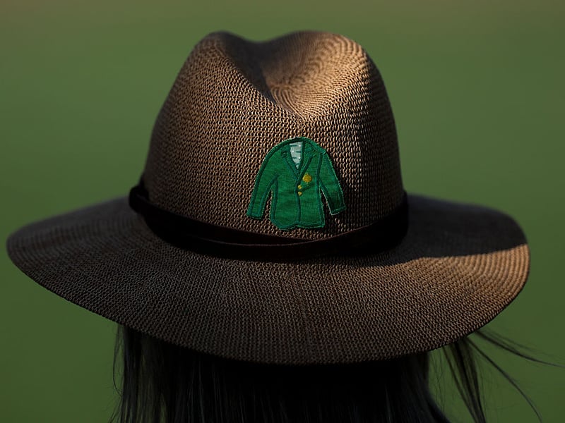 A patron's hat is seen on the course during the first round of the 2026 Masters.