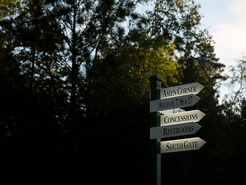 A detailed view of directional signage at the Masters.