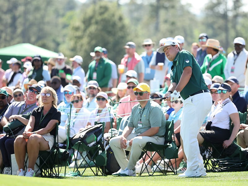 Sungjae Im of South Korea chips onto the 18th green.