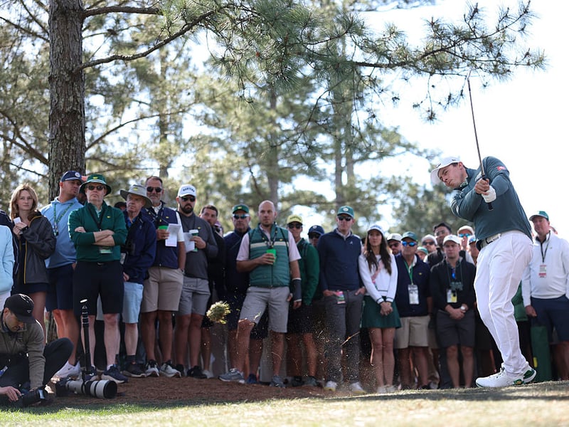 Matt Fitzpatrick of England plays a shot on the first hole.