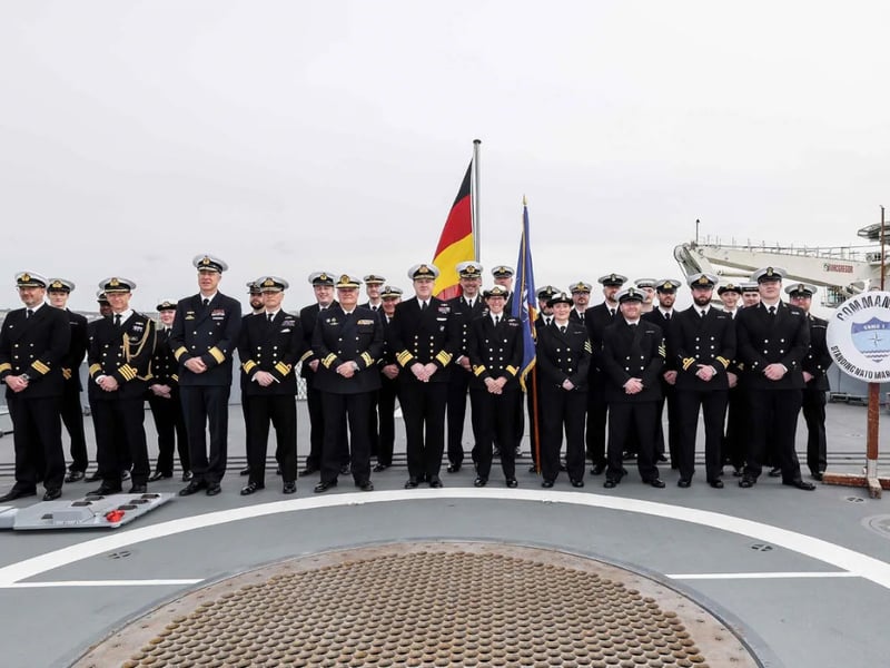 The Royal Navy has today taken command of NATO’s premier naval security force in Northern European waters during a ceremony in Portsmouth Naval Base. Pictured Commander Allied Maritime Command, Vice Admiral, Robert G Pedre, Incoming Commander for Standing NATO Maritime Group One (SNMG1), Commodore Maryla Ingham RN, Outgoing Commander for SNMG1, Rear Admiral Joaquin Ruiz Escagedo Spanish Navy, SNMG1 Staff and guests for the Change of Command Ceremony on the flight deck of FGS Sachsen at HMNB Portsmouth.
