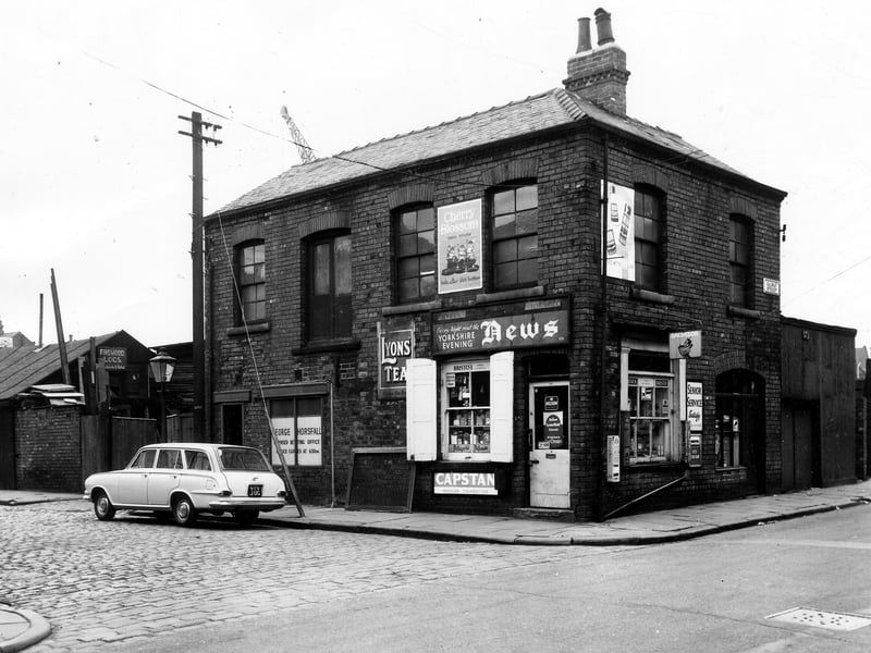 A corner shop at the junction of Galway Street and Kirkland Place pictured in June 1964. Signs advertise products typical of the day, some of which are still available. There is one on the door advertising 'I Spy Books' avidly collected by children at the time. Far left on Kirkland Place is Kirkland Motors, then a sign for 'Firewood logs wholesale and retail' then George Horsfall Licensed Betting Office next to the shop.