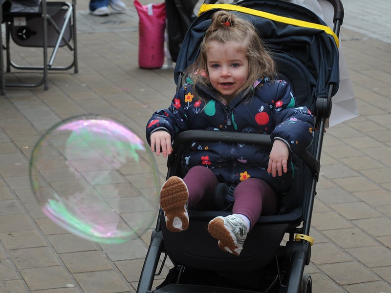 Florence Joyce-Bell of Bramley mesmerised by the bubbles.