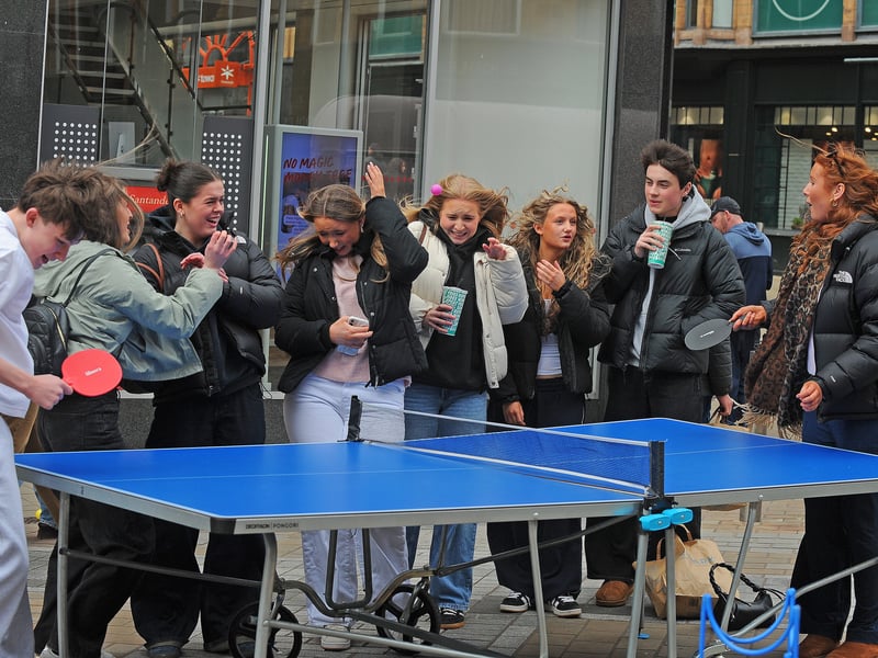 Students from the Northern Performance Academy try a game of table tennis in the wind.
