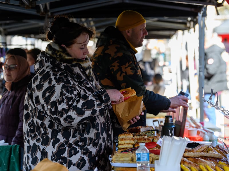 A trader bags up some tasty pastries