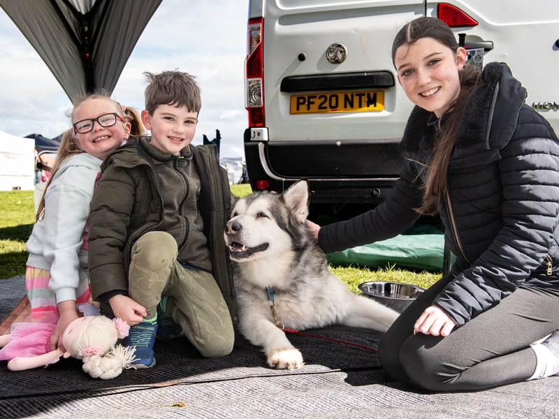 Young visitors meet the REACH Sled Dogs at the event.