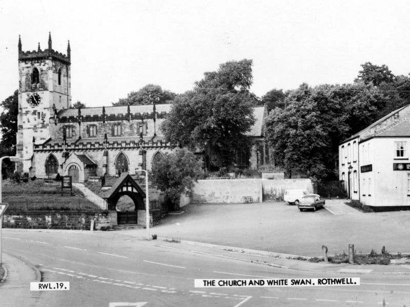 Holy Trinity Church taken from Church Street with Ingram Parade on the right. The White Swan pub is on the right. Pictured in September 1969.