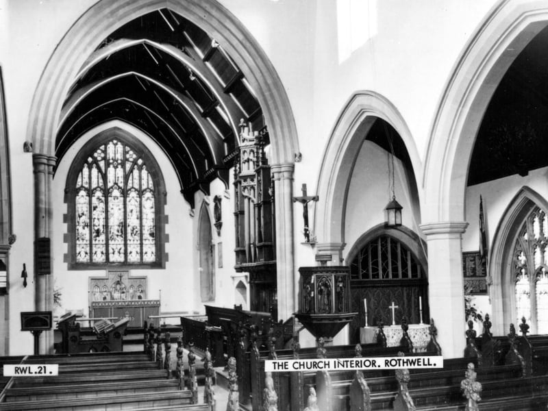 Inside Rothwell Parish Church looking towards the altar. The elaborate carved bench ends in the body of the church date from 1858, the pulpit from 1862 and the reading desk, lectern and choir stalls apparently from 1867. Pictured in September 1969.