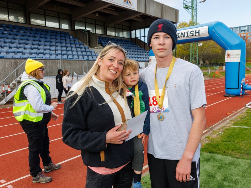 Eddie Trerise won 3K, pictured with his mum and brother.