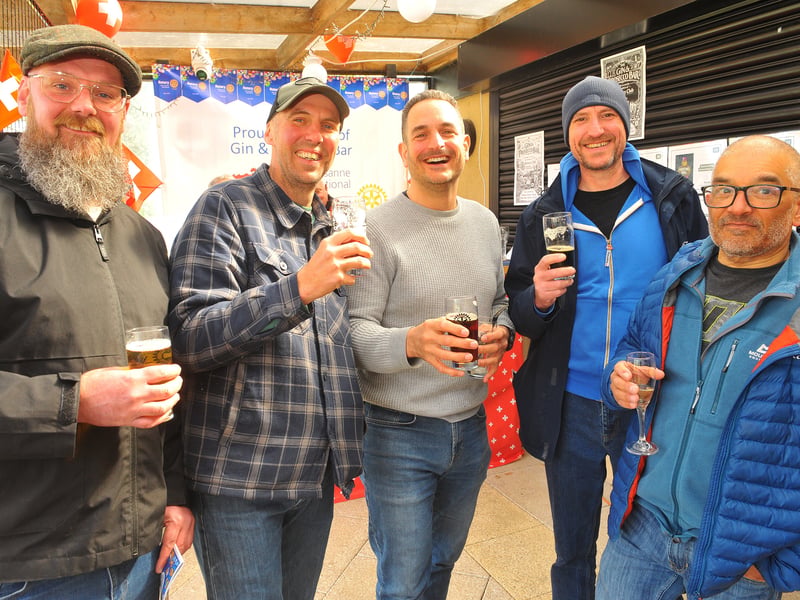 Revellers raise a glass.