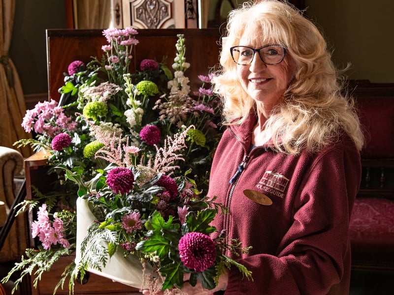 Jennifer Taylor, a volunteer house guide with an eye-catching floral display in one of the Lytham Hall boudoirs. 