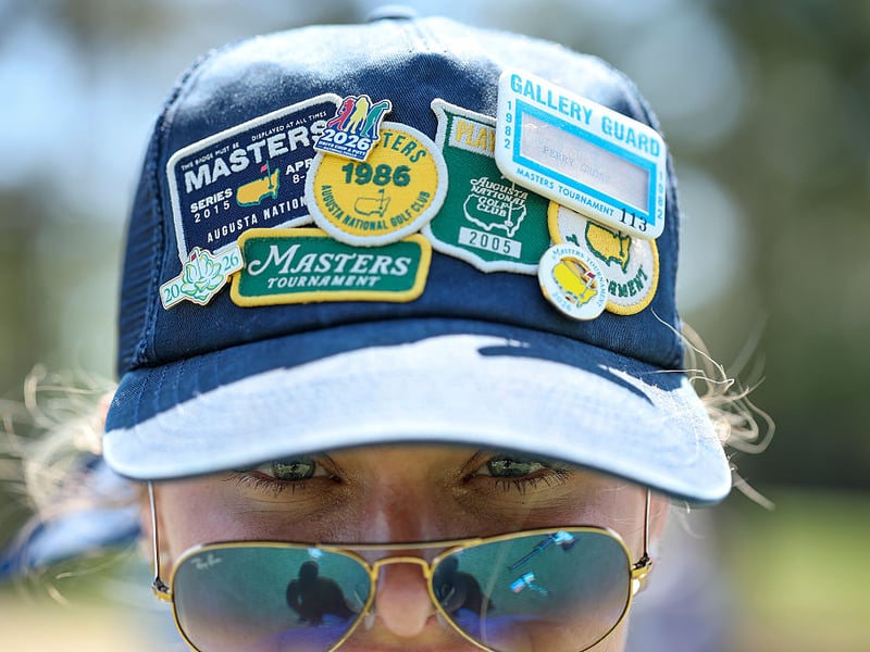 A patron poses for a portrait during the final round of the 2026 Masters Tournament at Augusta National Golf Club.