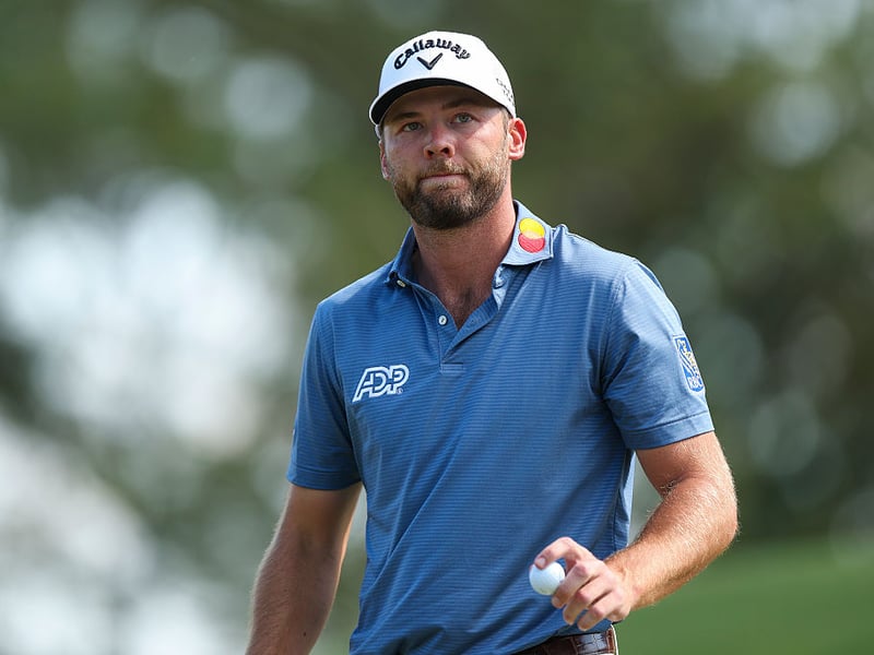 Sam Burns of the United States reacts on the eighth green.