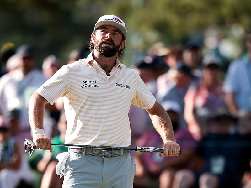 Cameron Young of the United States reacts after missing a putt on the 14th green.