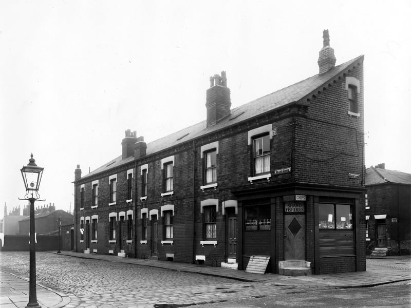On the left of the photo from April 1959 are numbers 2 to 8 Shand Grove, a row of back-to-back terraced houses with a shared outside toilet yard visible on the far left. On the right of the image and visible in the foreground is Jack Lane. At the corner with Shand Grove is number 6 Jack Lane, the Shand Fisheries. On the far right is New Princess Street.