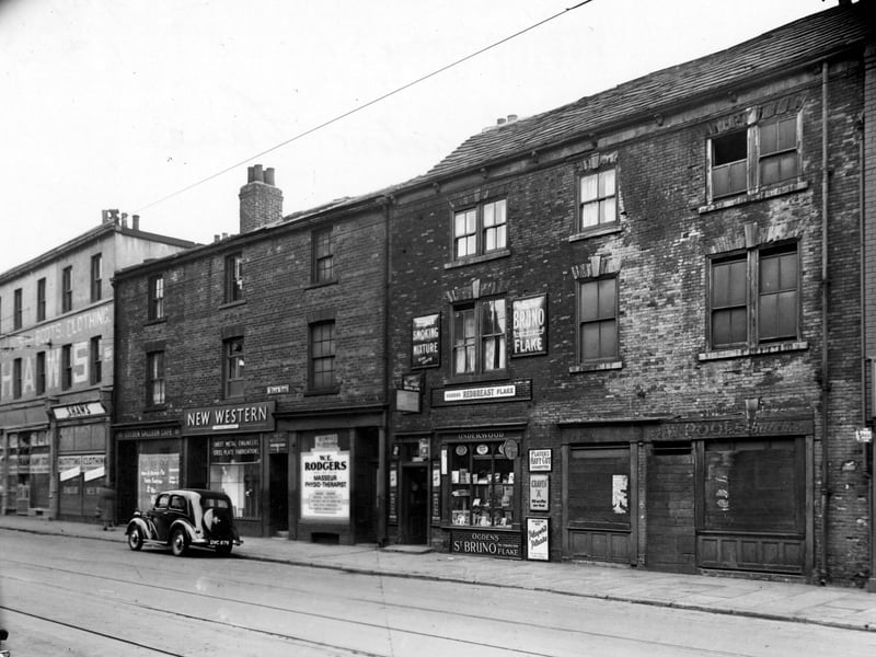 Meadow Lane, showing New Western Street Metal Engineers, W.E. Rodgers masseur and physiotherapist, A.E. Underwood, tobacconist. Entrance to Hill's yard can be seen between New Western and W.E. Rodgers. Pictured in  October 1951.