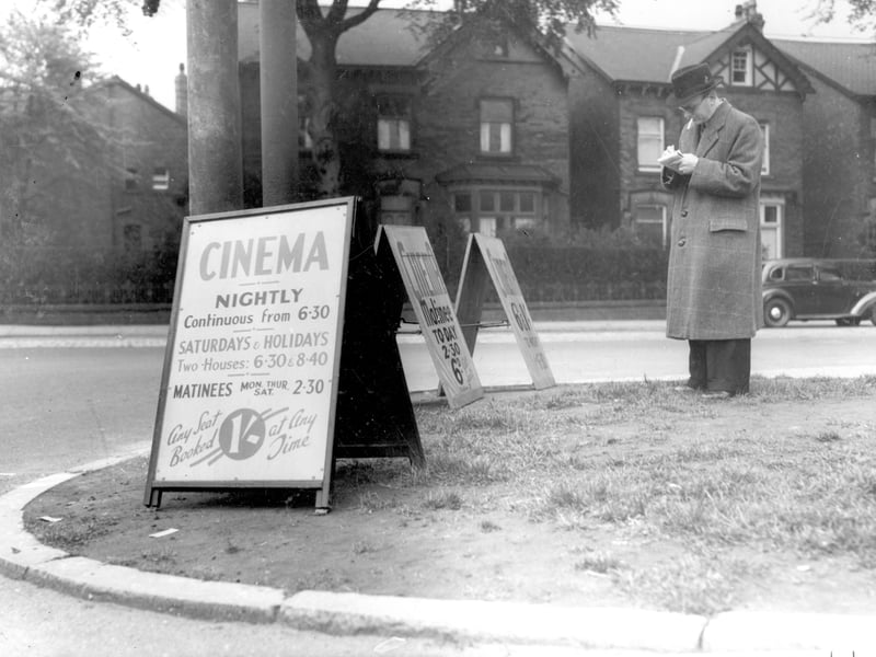 Advertising boards for the Corner House cinema on junction of Street Lane with Harrogate Road in May 1939.