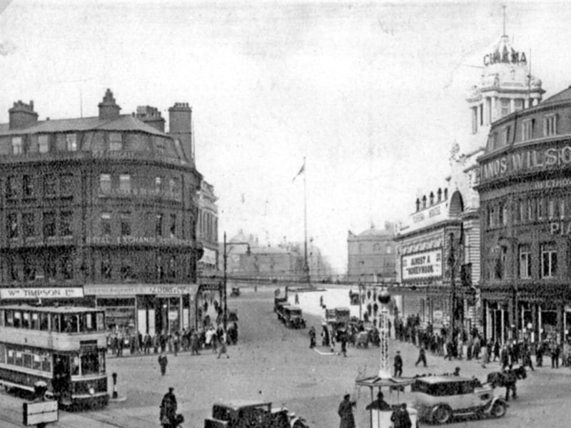 Town Hall Square, Sheffield city centre, looking towards Barker's Pool, sometime between 1930 and 1934. J. Lyons and Co dining and tea rooms are on the left, with Cinema House and Wilson Peck on the right.