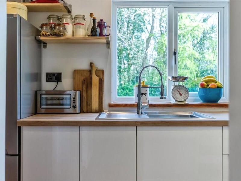 The kitchen overlooks the rear garden