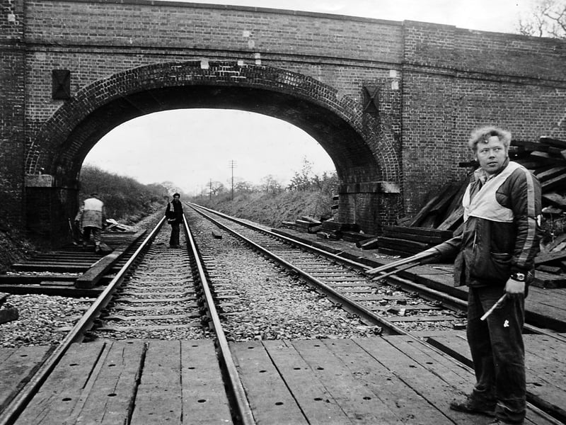A scene from Tilley, Wem in January 1977, as railway workers prepare a temporary crossing ahead of the demolition of the old bridge to Tilley Park Farm. Cracks had made the structure unsafe, bringing an end to a long-standing local landmark before its replacement with a new concrete span.