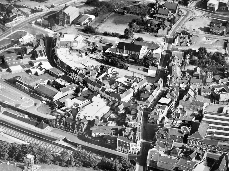 An aerial view of Wellington town centre in August 1977, showing the main shopping area before it became traffic free, along with the railway station and Methodist church clearly visible. This bird’s-eye snapshot captures the layout of the town as it appeared nearly half a century ago.