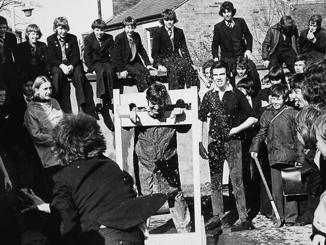 A lively moment from The Priory School for Boys in Shrewsbury during charity week in March 1977, where deputy head Mr John Andrews gets a soggy sponge to the face as pupils raise money for good causes. The event helped support local charities, including services for older people and the Shropshire Talking Newspaper for the Blind.