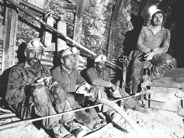 A powerful glimpse into working life at Granville Colliery, Telford, in November 1977, showing miners taking their snap” break underground where there were no canteen or facilities. Pictured are Ernest Lowe, John Marlow, Ray Watson and Stewart Braddock — a stark reminder of the tough conditions faced by those working deep beneath the surface.