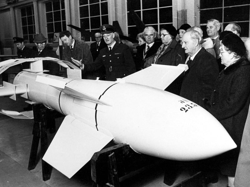A visit to RAF Cosford Aerospace Museum in January 1977, where civic leaders from Shropshire and the West Midlands were given a guided tour of the station’s collection. Squadron Leader Peter Coombes is pictured showing guests around the rocket section, including Second World War German rockets and other historic aircraft on display.