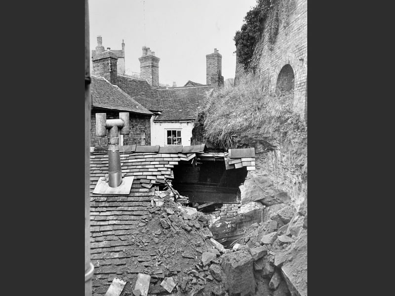 The aftermath of a landslide along Ebenezer Row, Bridgnorth, captured in a striking view from Mr Harry Tolley’s bathroom showing damage to a neighbouring roof and the overhang of sandstone. The slip occurred the previous evening, Friday, March 4, 1977.
