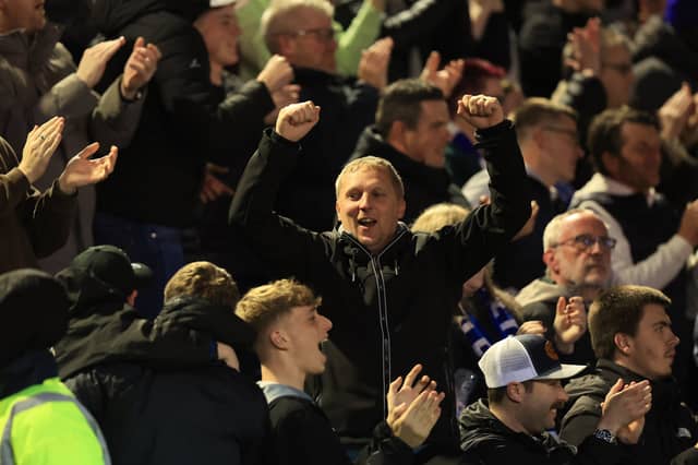 Brilliant photos of jubilant Pompey faithful celebrating triumph over Ipswich Town under the lights at Fratton.
