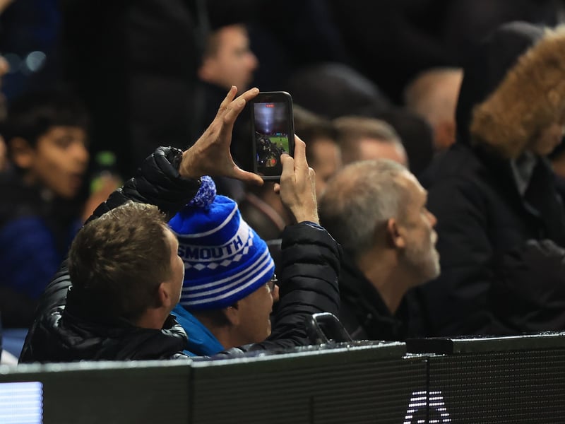 Brilliant photos of jubilant Pompey faithful celebrating triumph over Ipswich Town under the lights at Fratton.