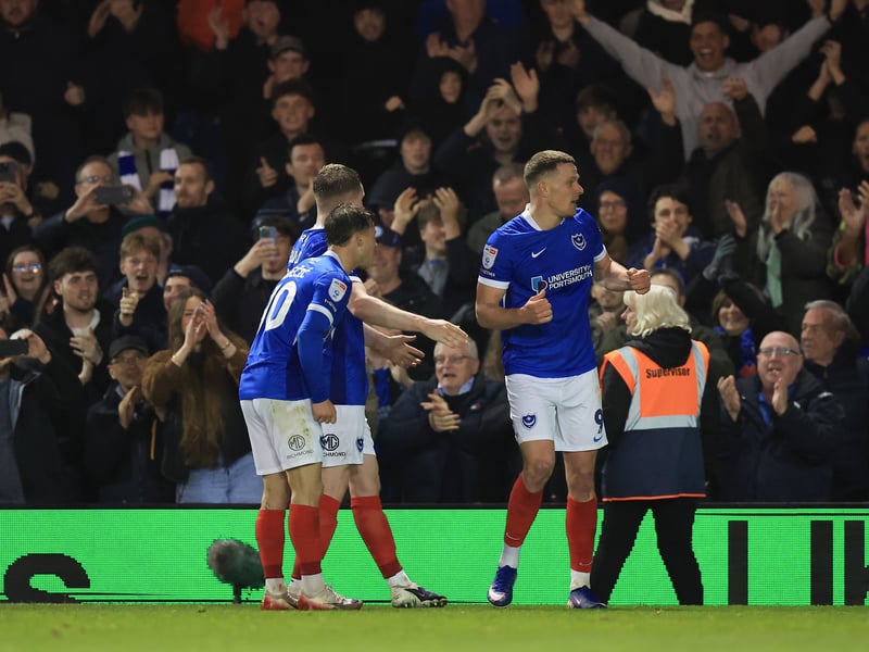 Colby Bishop celebrates Pompey's second goal in front of the North Stand lower.