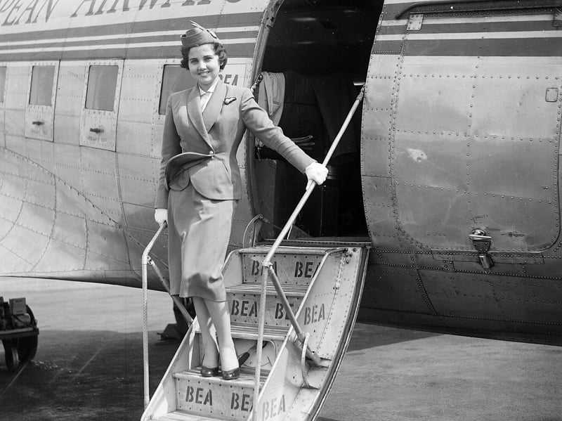 Jill Morgan, an air hostess with BEA (British European Airways), stands on rhe steps to a plane at Turnhouse airport in June 1955
