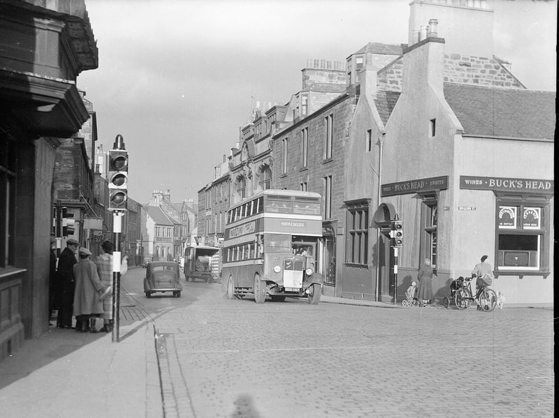 A bus stops at traffic lights on High Street, Dalkeith, Midlothian, in 1953. It was announced that year that a one-way system was to be introduced to ease the bottleneck on the street.