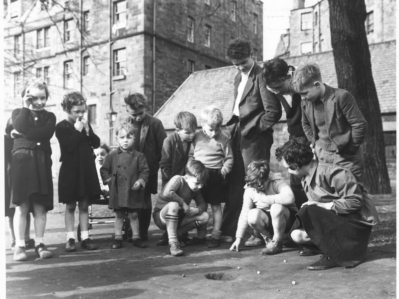 Children playing marbles on an Edinburgh Street in April 1955