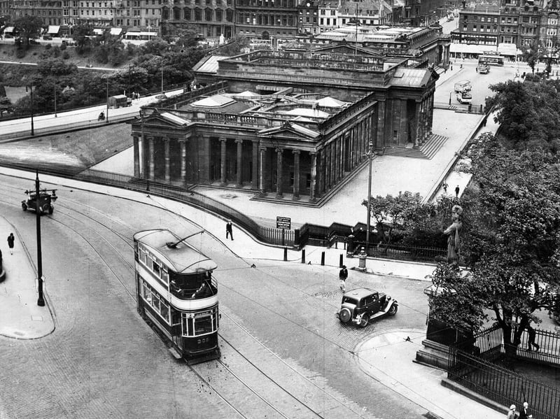 A tram makes its way up The Mound, Edinburgh, with snow lying on the ground, in May 1955