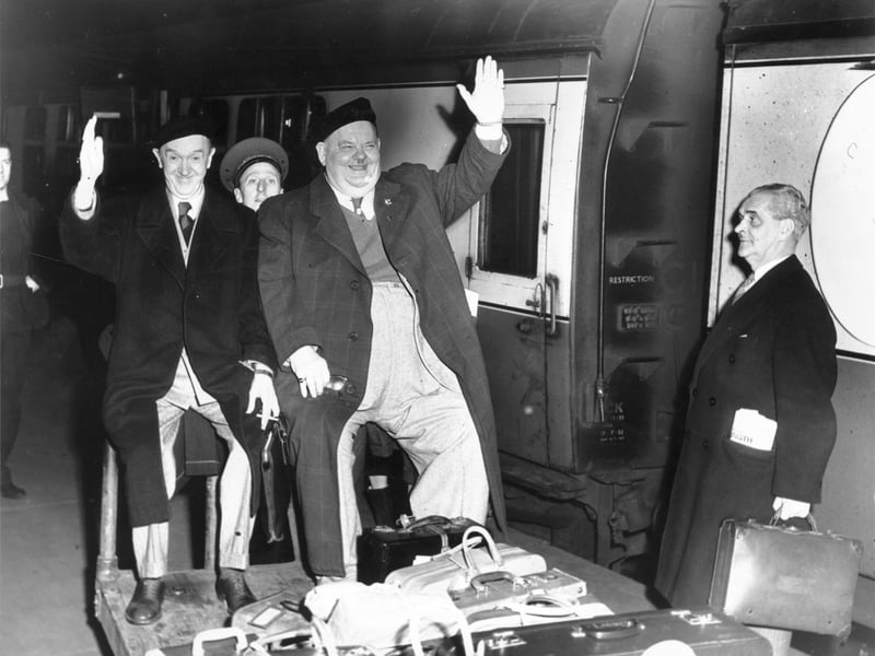 Stan Laurel and Oliver Hardy at the Caledonian railway station, Edinburgh, in April 1954. They were on their way to stay at the Caledonian Hotel whilst they were appearing at the Empire Theatre.
