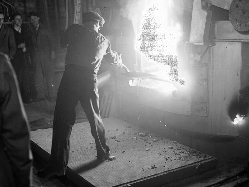 An employee working at a blast furnace at Colvilles Steelworks, Ravenscraig, in August 1957