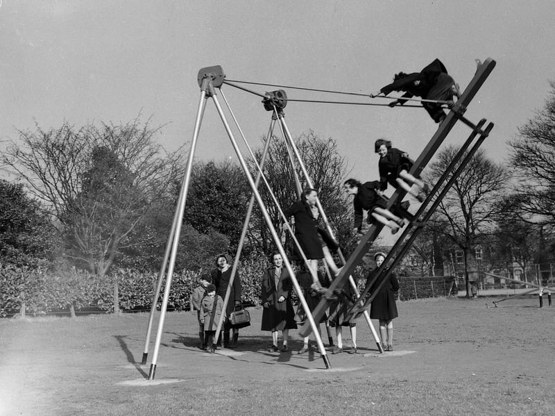 Children on swings at Beveridge Park, Kirkcaldy,  Fife, in April 1953