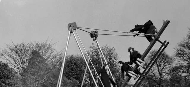 Children on swings at Beveridge Park, Kirkcaldy, Fife, in April 1953