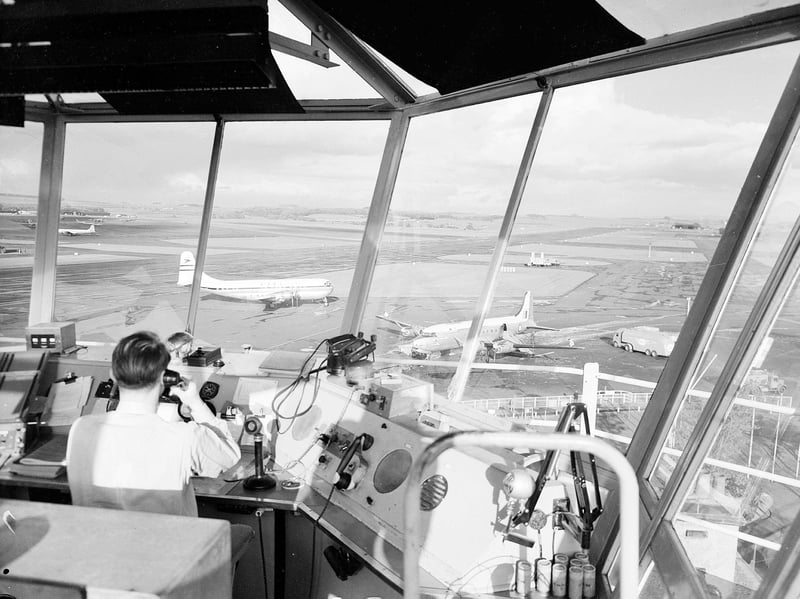 The view from the control tower at Prestwick Airport in July 1955, with the pilot of a Stratocruiser being given instructions for parking