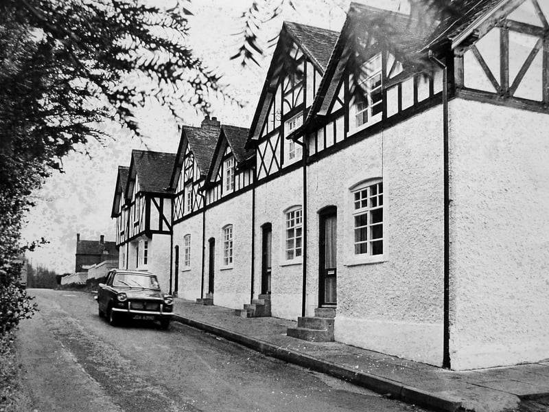A row of six cottages in Ackleton near Bridgnorth, pictured in 1973 after being restored from near dereliction thanks to a supportive owner and a government grant, with a Triumph Herald parked outside.