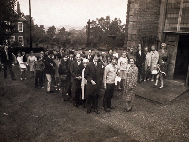 Dated 25 September 1971, this photograph shows almost the entire village of Hampton Loade—along with a few regulars from the local pub—gathered for a church service, thought to be at nearby Quatt.