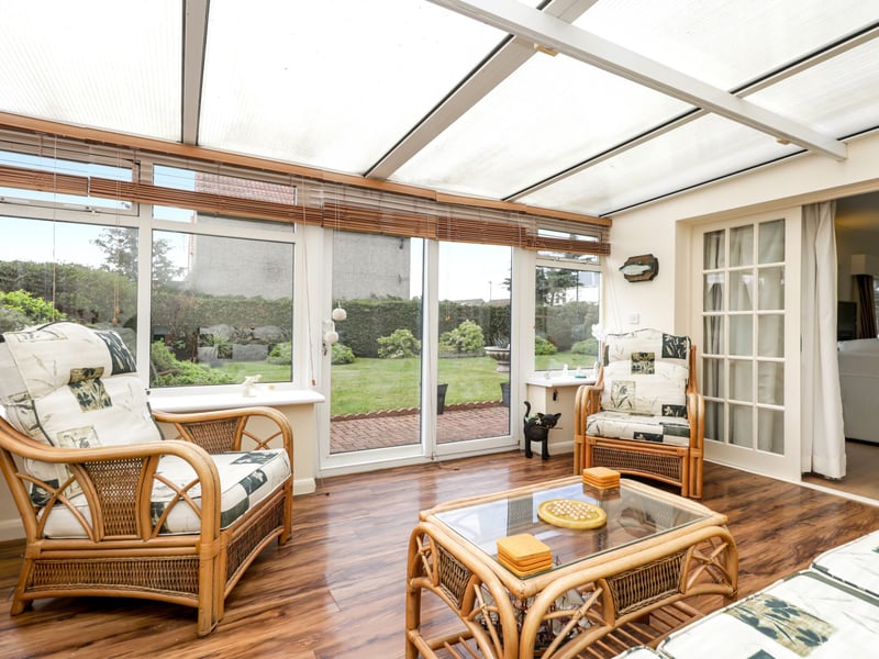The garden facing conservatory is a great place to relax with family after a long day.