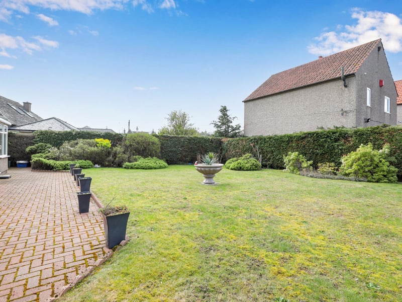 Externally the large wrap round garden has a secluded section laid to lawn with a colourful array of plants and shrubs and low maintenance areas of artificial turf.