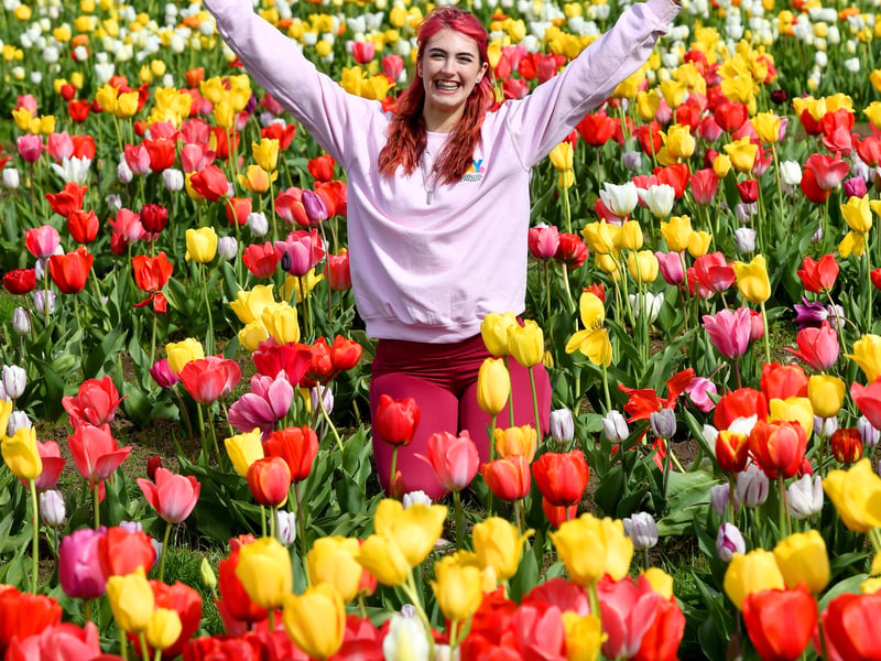 Staff member Marley Dowding enjoys the flowers