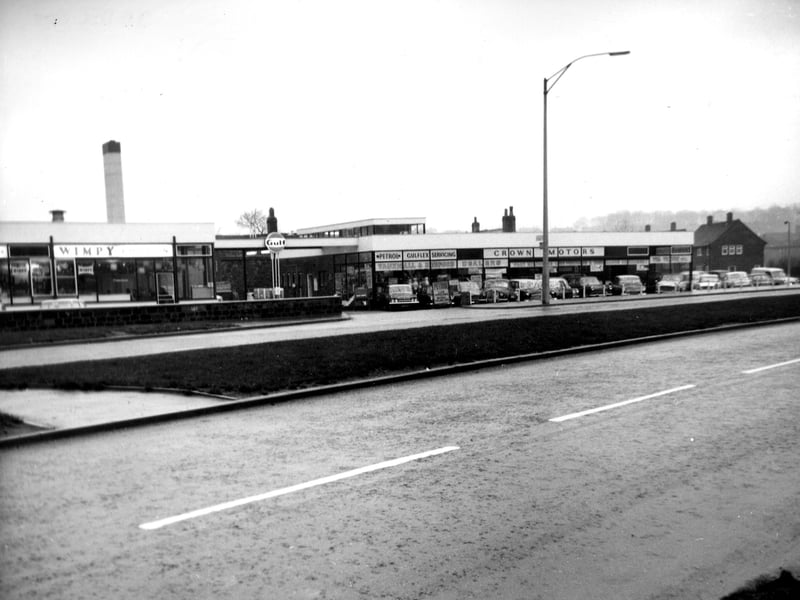 Barwick Road at the junction with York Road, off camera,left, showing the Wimpy restaurant on the left. In later years it was a branch of Halfords.  Pictured in December 1965.